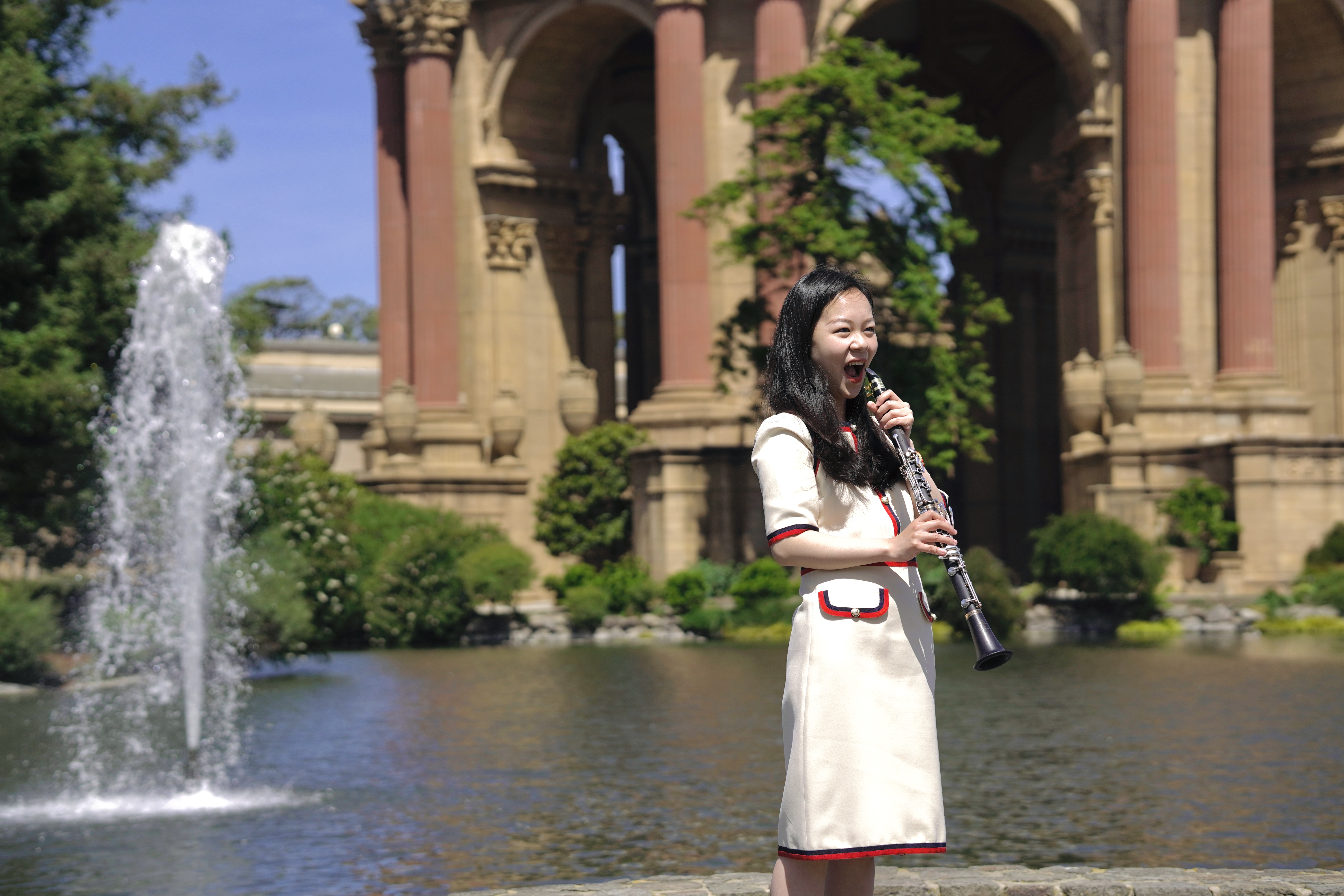 Yijin Wang with her clarinet at the Palace of Fine Arts